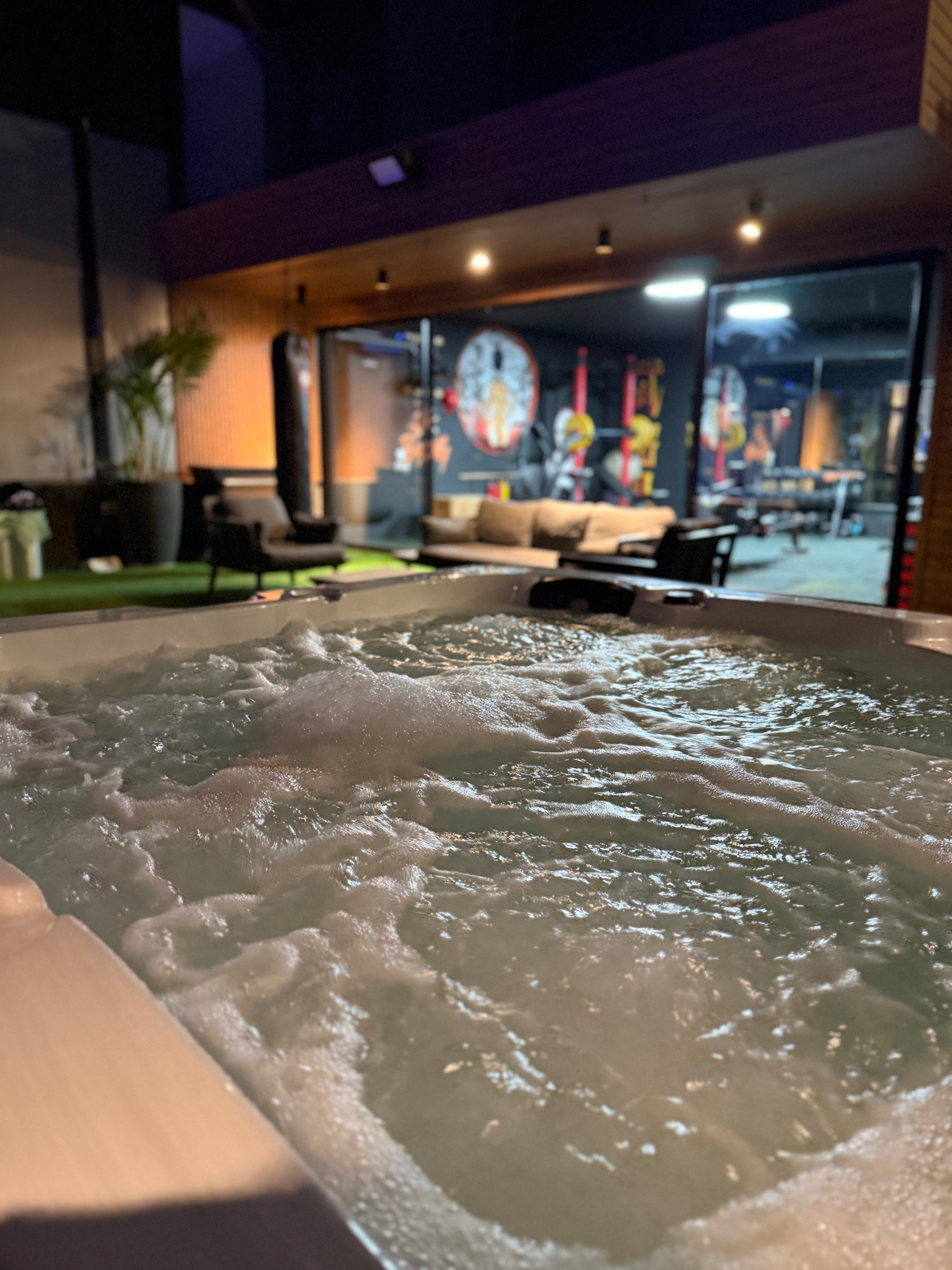 Heated jacuzzi beside the gym at night