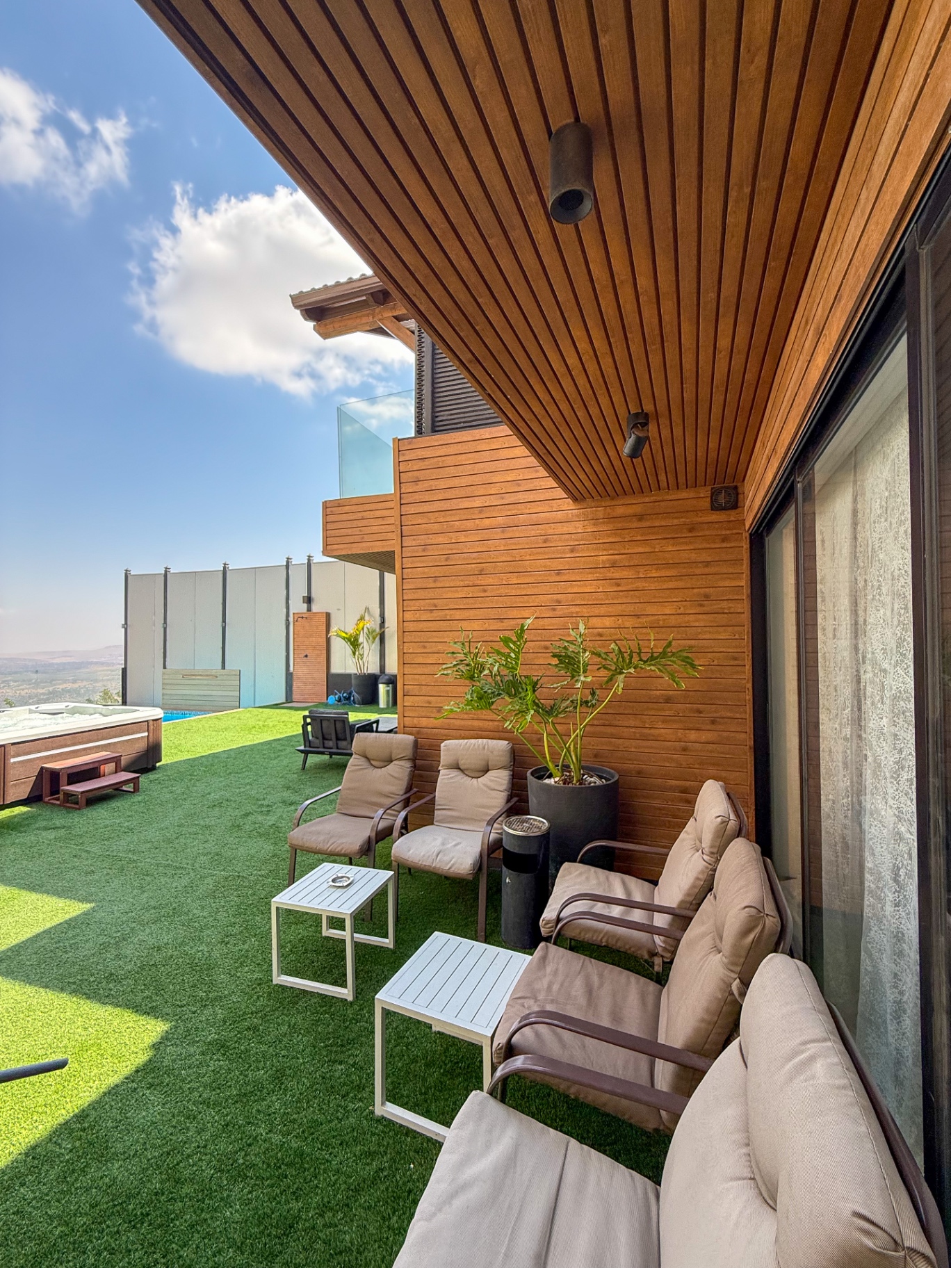 Shaded cedar terrace with lounge seating