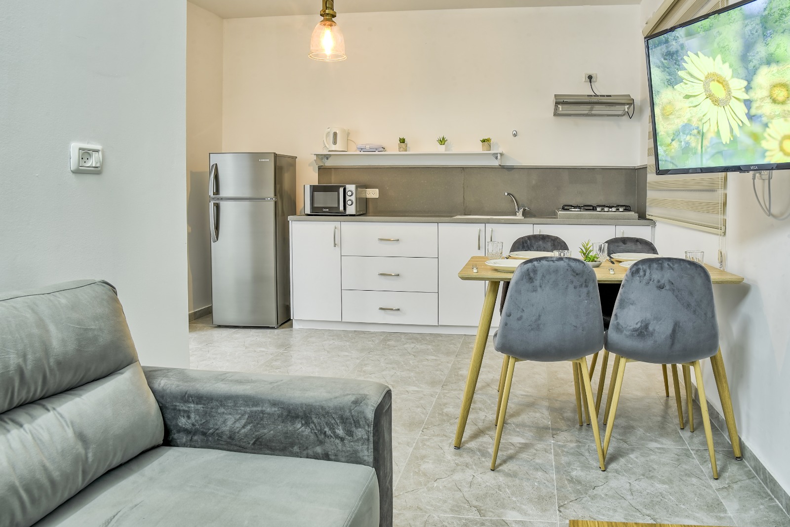 Living, dining and kitchen as one airy stage