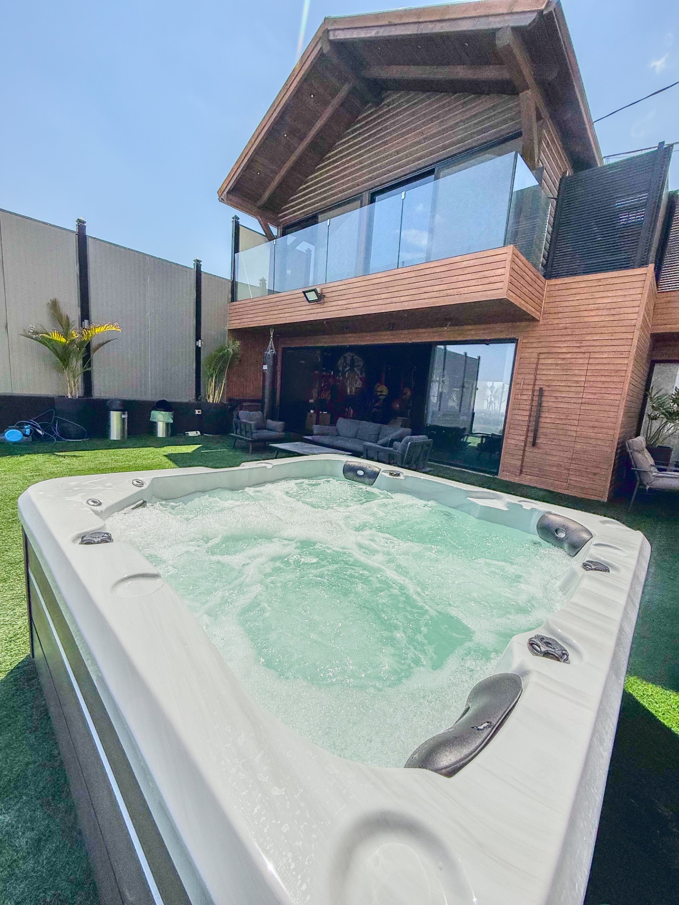 Outdoor jacuzzi on the lawn at dusk