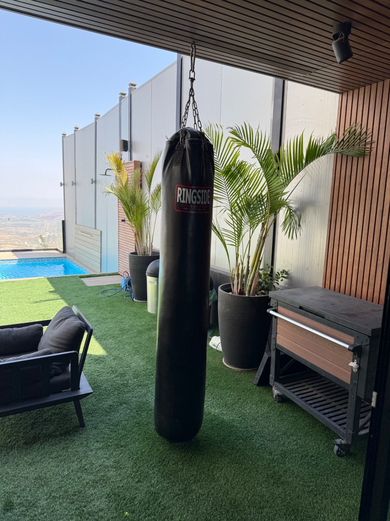 Outdoor boxing station beside the pool