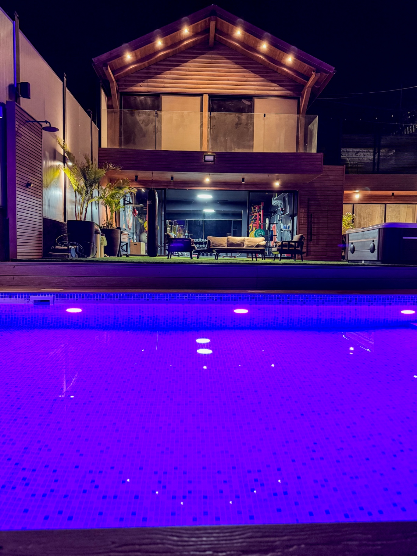 Main pool lit in deep purple